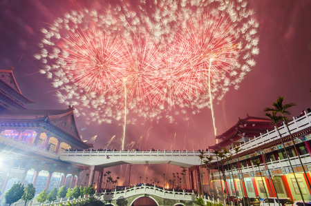 Holiday firework over a temple