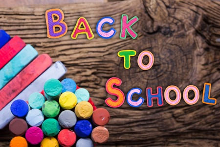 Back to school desk table top view words on grunge old wooden board background education concept time to learn