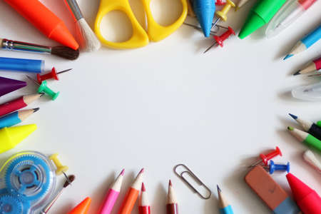 Stationery on colored background set of pencils and various devices Stock Photo