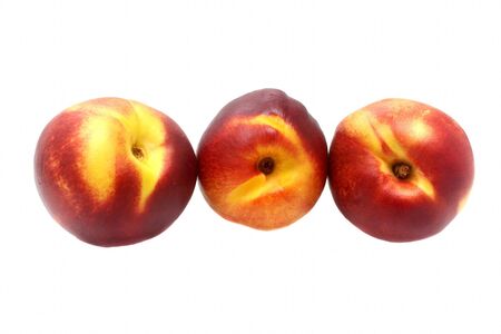 Three ripe nectarine isolated on white background Stock Photo