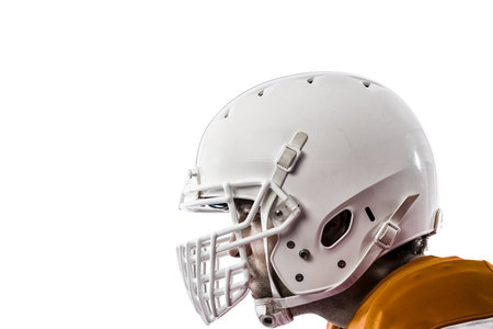 Close up of a football player with a orange uniform on a white background Stock Photo