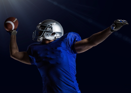 Digital composition of american football player throwing rugby ball against blue background