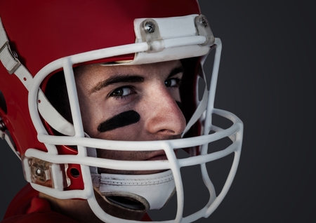 Digital composite of man in helmet against dark grey background