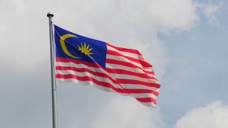 Flag of malaysia a flag of malaysia flies above the immigration building across from the thailand border in sungay gulok