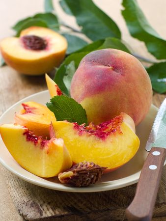 Fresh peaches on plate Stock Photo