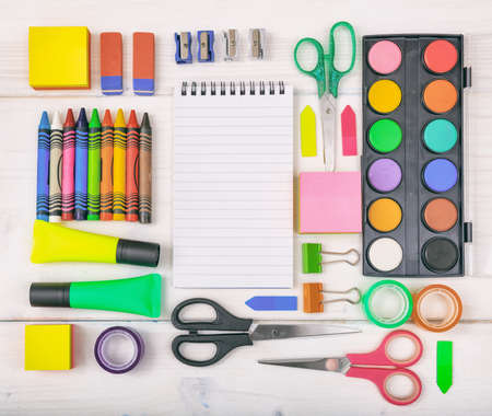 School supplies on white background space for caption