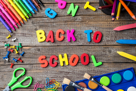 School supplies or accessories on an old wooden table