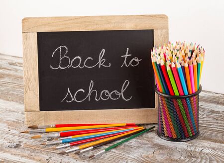 Back to school school supplies on wooden background