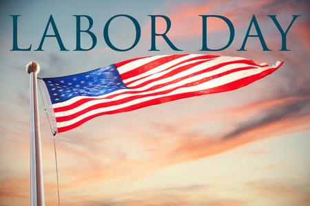 Labor day text against cloudy sky landscape