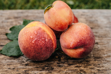 Fresh peaches peach close up fruit background peach on wood background sweet peaches group of peaches sliced peaches peach slices Stock Photo