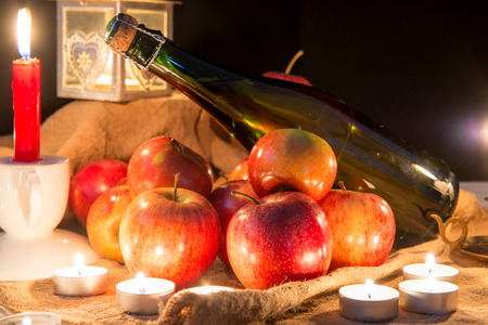 A bottle of cider and apples for christmas