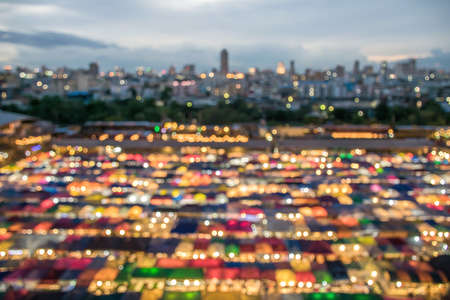 Blurred lighhts from colorful food stalls at rod fai night market on 25 sep 2017 in bangkok thailand Stock Photo