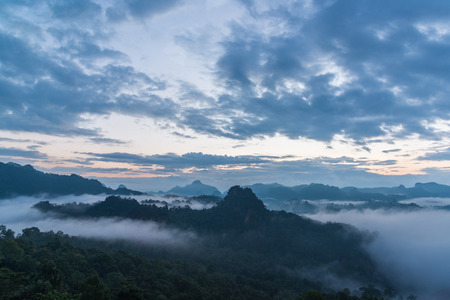 Mountain view with foggy environment during sunrise in the morning in rural of thailand Stock Photo