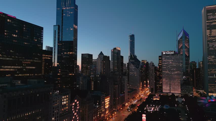 Chicago Illinois USA aerial drone wide footage of Chicago Downtown skyscraper at night time. Wide view