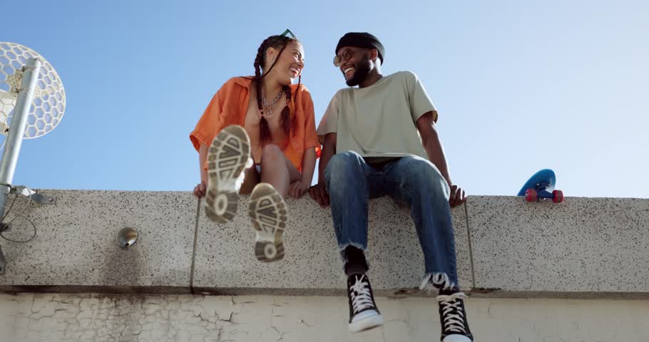 Joke, fashion and wall with young couple hang out on city building together bonding. Interracial stylish young people on a funny city date. Silly, goofy and laughing black man and woman joking